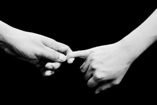 Two arms with holding hands
