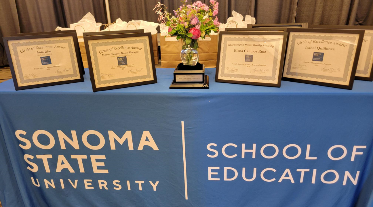 Awards Table with Certificates and Steuben Glass Apple