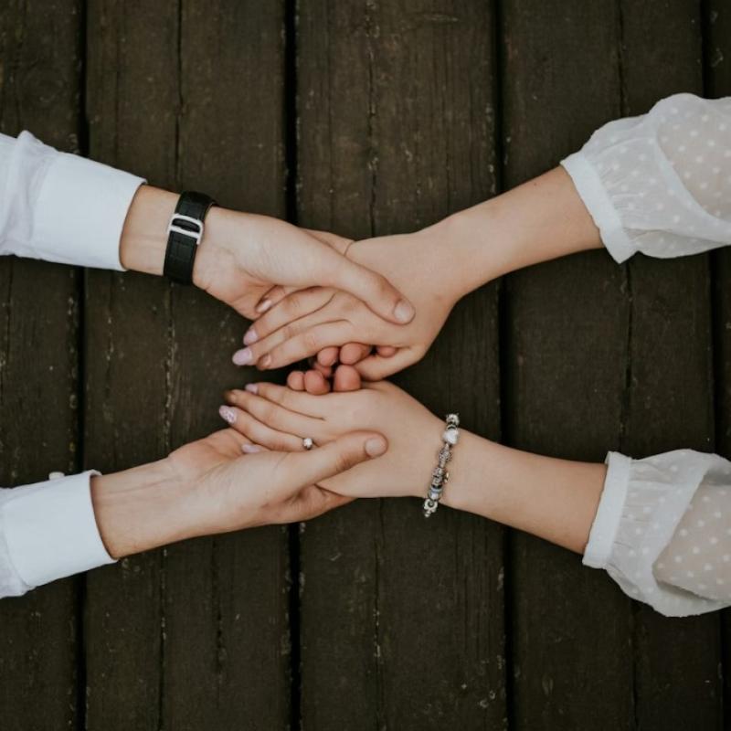 arms with hands clasping hands