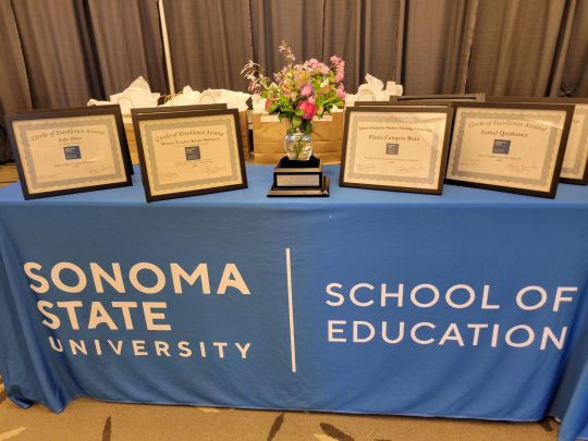 Awards Table with Certificates and Steuben Glass Apple