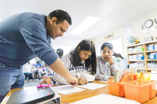 Teacher with students in classroom